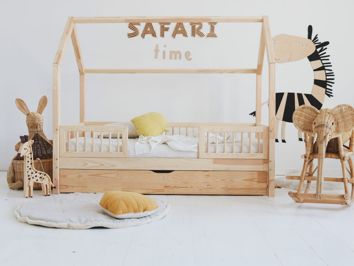 4. Child's bedroom with 'Safari Time' wooden wall sign above bed and animal-themed decor
