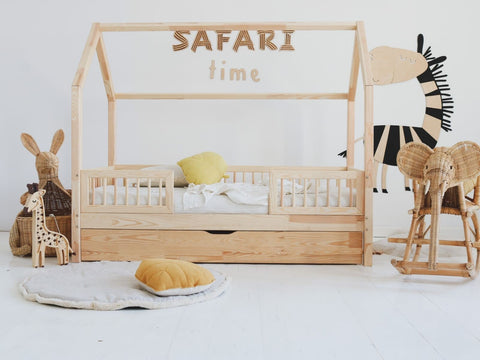 4. Child's bedroom with 'Safari Time' wooden wall sign above bed and animal-themed decor