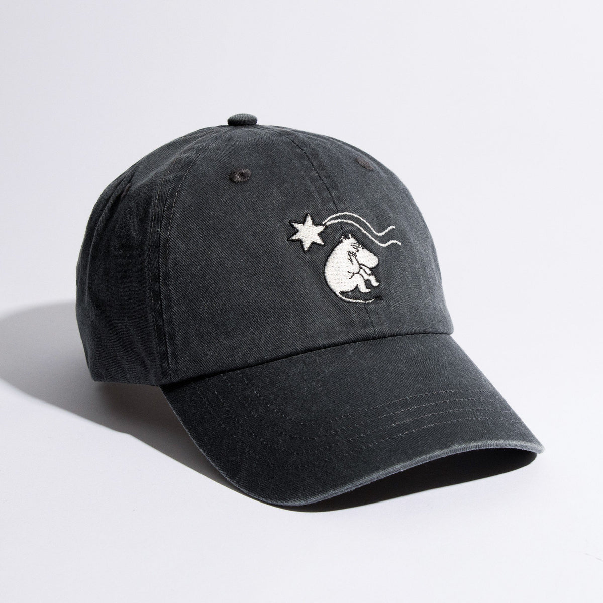 3. Studio shot of Moomin by NordicBuddies grey washed denim cap with Moomin embroidery, angled view