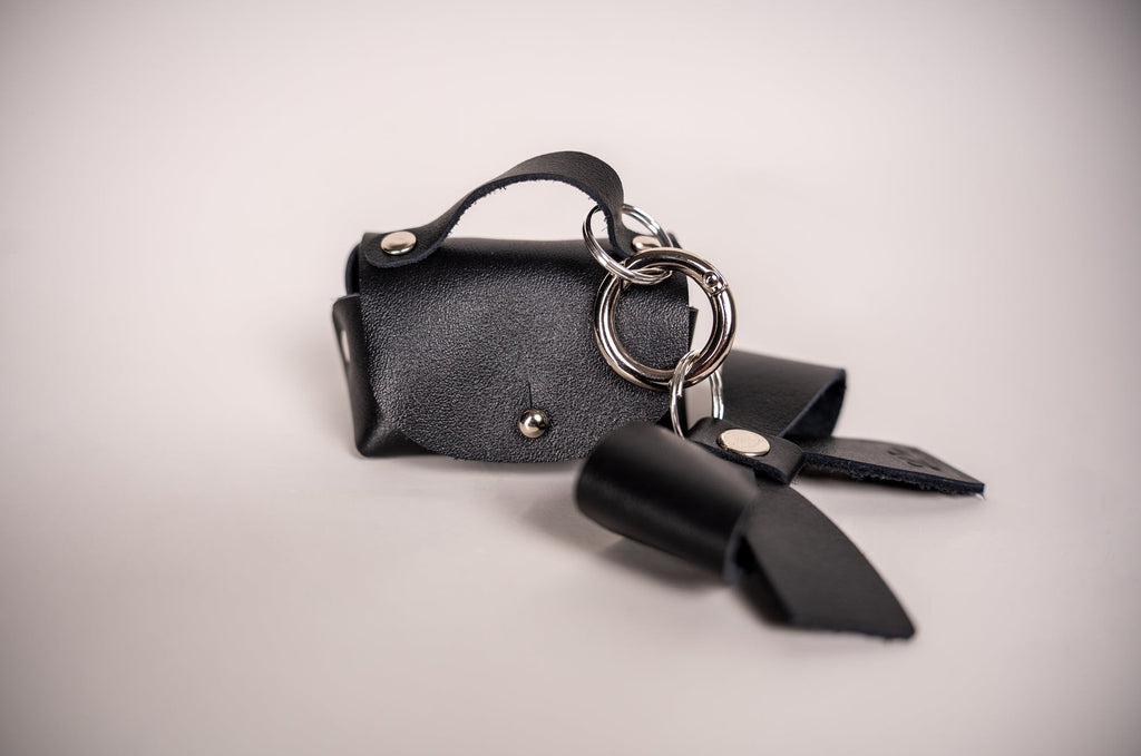 6. Studio shot of Zelma Kraft mini leather charm with bow and silver hook, showcasing craftsmanship