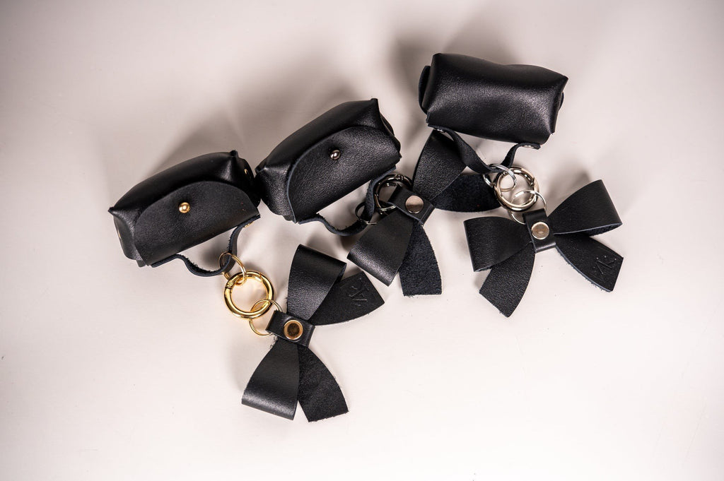 9. Collection of Zelma Kraft mini leather charms with bows, featuring silver and gold hooks