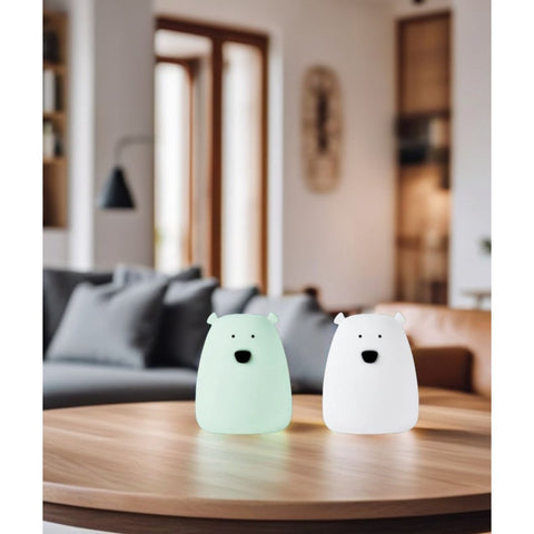 1. White and arctic green mini bear lights on a wooden table in a cozy living room setting